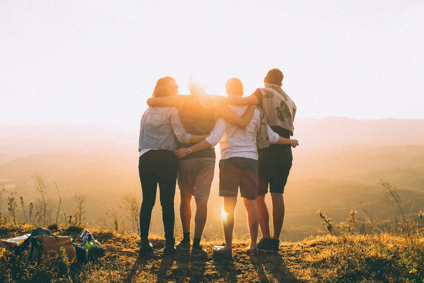 Four friends together in the sunshine